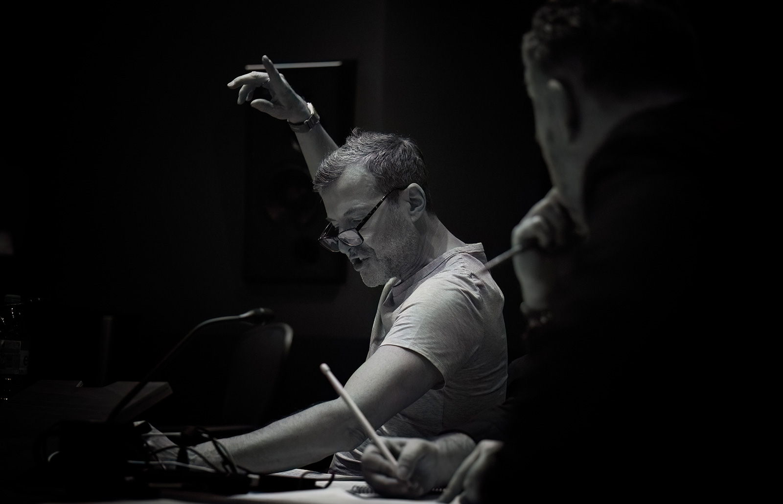 Tom Croxon leading an orchestral recording session during music production